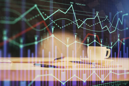 Multi exposure of forex graph drawing and desktop with coffee and items on table background. Concept...