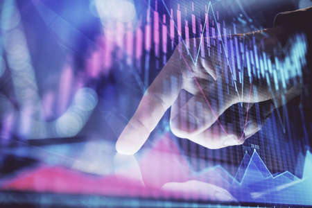 Multi exposure of mans hands holding and using a phone and financial chart drawing. Market analysis...