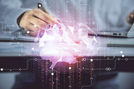 Multi exposure of womans writing hand on background with brain hologram. Concept of brainstorming.