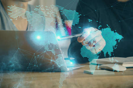 Media network theme hologram with man working on computer on background. Concept of internet...