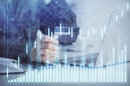 Multi exposure of woman on-line shopping holding a credit card and financial graph drawing. Stock...