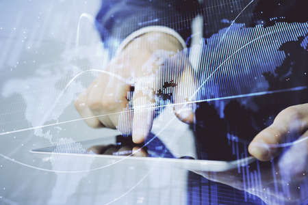 Multi exposure of mans hands holding and using a phone and financial chart drawing. Market analysis...