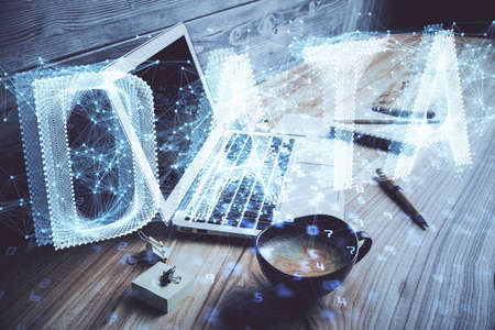 Double exposure of desktop with personal computer on background and tech theme drawing. Concept of data analysis.の写真素材