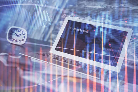 Financial market graph hologram and personal computer on background. Double exposure. Concept of...