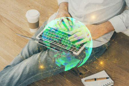 Media network theme hologram with man working on computer on background. Concept of internet communication. Double exposure.の写真素材