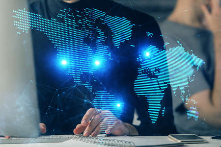 Media network theme hologram with man working on computer on background. Concept of internet...