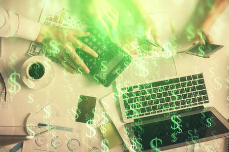 Double exposure of man and woman working together and financial chart hologram drawing. market...