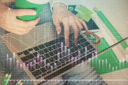 Double exposure of woman hands typing on computer and forex chart hologram drawing. Stock market...