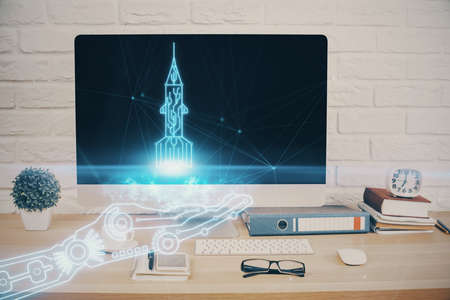 Desktop computer background in office and start up theme hologram drawing. Double exposure. Startup...