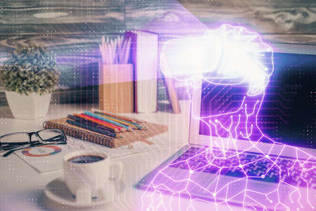 Computer on desktop with AR theme icon. Multi exposure. Concept of augmented reality.の写真素材