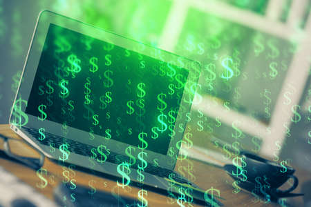 Forex market chart hologram and personal computer background. Multi exposure. Concept of investment.の写真素材