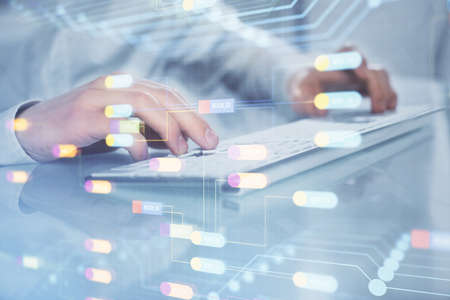 Multi exposure of tech drawings with man working on computer background. Concept of innovation.の写真素材