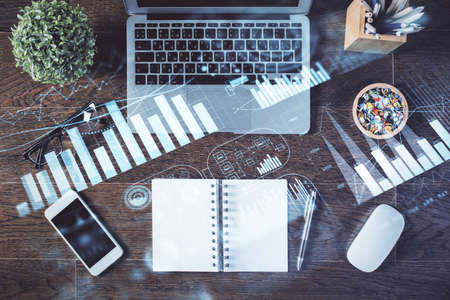 Stock market graph and top view computer on the table background. Multi exposure. Concept of...