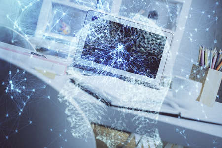 Double exposure of work space with computer and human brain drawing hologram. Brainstorm concept.の写真素材