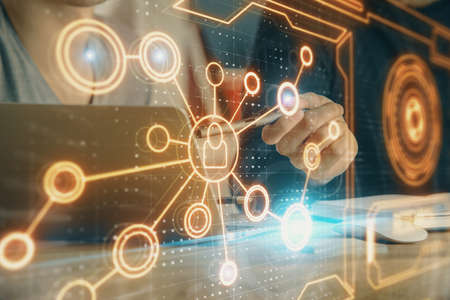 Media network theme hologram with man working on computer on background. Concept of internet...