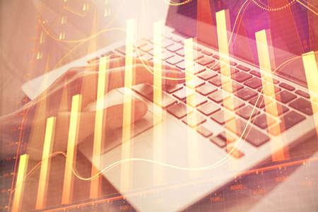 Double exposure of woman hands typing on computer and forex chart hologram drawing. Stock market...
