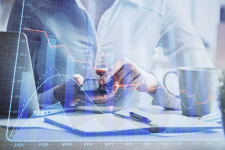 Double exposure of forex chart sketch hologram and woman holding and using a mobile device....