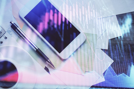 Multi exposure of forex graph hologram over desktop with phone. Top view. Mobile trade platform concept.の写真素材