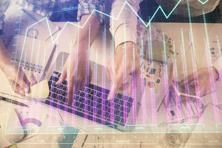 Multi exposure of man and woman working together and forex graph hologram drawing. Financial...