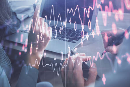 Double exposure of man and woman working together and forex chart hologram. Business concept....