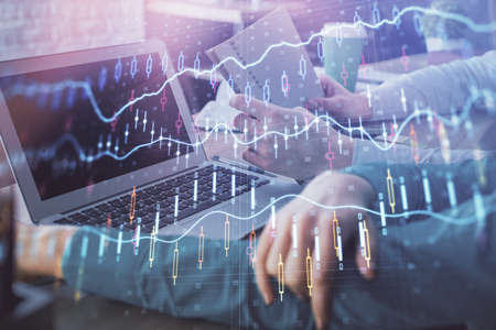Double exposure of man and woman working together and forex chart hologram. Business concept....