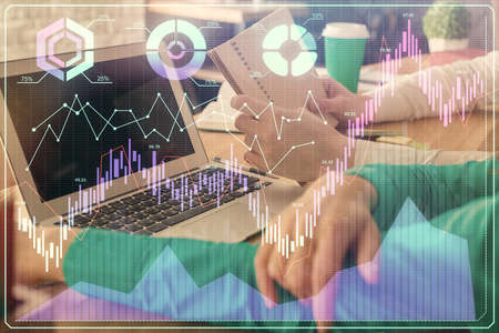 Double exposure of man and woman working together and forex chart hologram. Business concept....