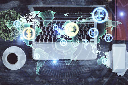 Stock market chart and top view computer on the table background. Double exposure. Concept of...