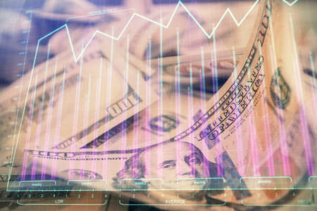 Double exposure of forex graph drawing over us dollars bill background. Concept of financial...