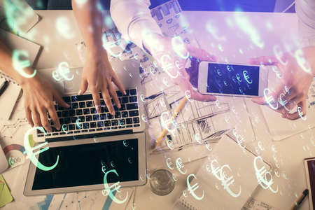 Multi exposure of man and woman working together and forex graph hologram drawing. Financial...