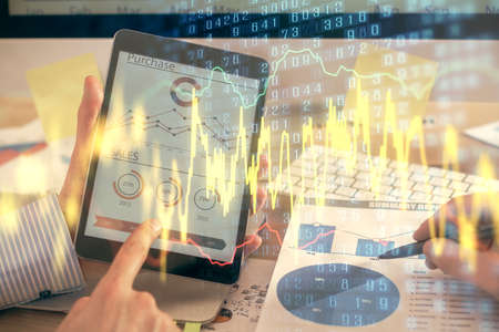 Multi exposure of mans hands holding and using a phone and financial chart drawing. Market analysis...