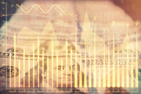 Double exposure of forex graph drawing over us dollars bill background. Concept of financial...