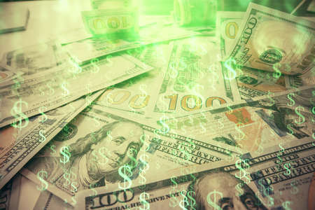 Multi exposure of forex chart drawing over us dollars bill background. Concept of financial success...