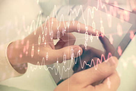 Multi exposure of mans hands holding and using a phone and financial chart drawing. Market analysis concept.の写真素材