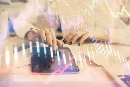 Double exposure of forex chart sketch hologram and woman holding and using a mobile device....