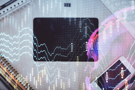 Double exposure of forex graph hologram over desktop with phone. Top view. Mobile trade platform...