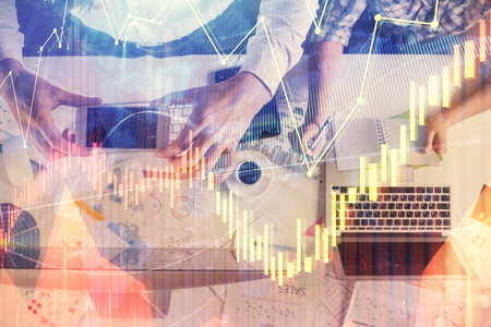 Double exposure of man and woman working together and financial chart hologram drawing. market...