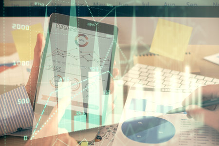 Multi exposure of mans hands holding and using a phone and financial chart drawing. Market analysis concept.の写真素材