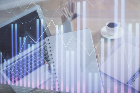 Double exposure of businesswoman hands typing on computer and forex chart hologram drawing. Financial analysis concept.の写真素材