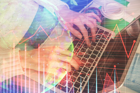 Double exposure of woman hands typing on computer and forex chart hologram drawing. Stock market invest concept.の写真素材