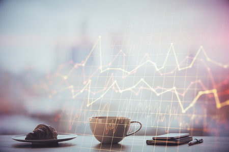 Double exposure of forex chart over coffee cup background in office. Concept of financial analysis and success.の写真素材