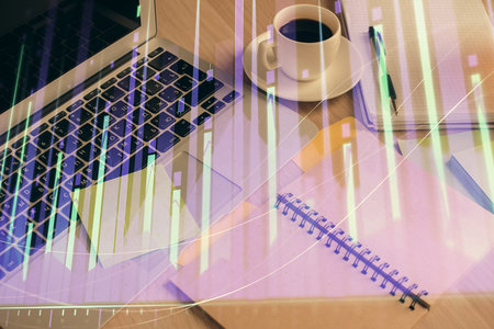 Multi exposure of forex graph drawing and desktop with coffee and items on table background. Concept of financial market tradingの写真素材