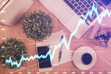 Multi exposure of financial chart hologram over desktop with phone. Top view. Mobile trade platform concept.の写真素材