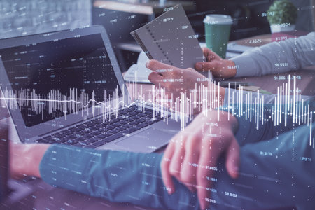 Double exposure of man and woman working together and forex chart hologram. Business concept....