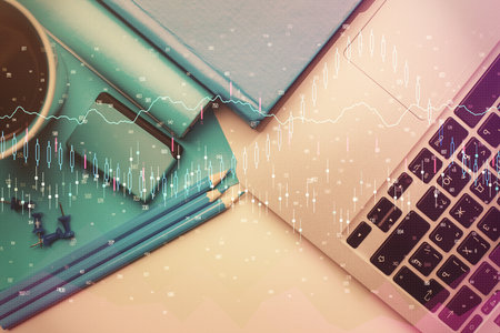 Double exposure of forex graph drawing over desktop background with computer. Concept of financial analysis. Top view.の写真素材