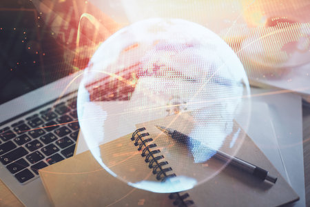 Double exposure of business theme drawing and desktop with coffee and items on table background. Concept of market tradingの写真素材