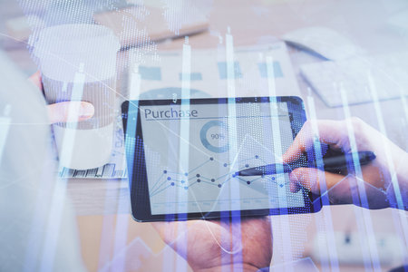 Double exposure of mans hands holding and using a phone and financial chart drawing. Market analysis concept.の写真素材