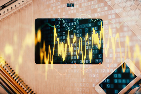Double exposure of forex graph hologram over desktop with phone. Top view. Mobile trade platform concept.の写真素材