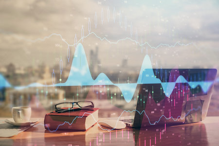 Double exposure of financial chart drawings and desk with open notebook background. Concept of forex marketの写真素材