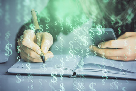 Double exposure of businesswoman hands typing on computer and forex graph hologram drawing. Financial analysis concept.の写真素材