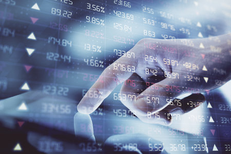 Multi exposure of mans hands holding and using a digital phone and forex graph drawing. Financial...